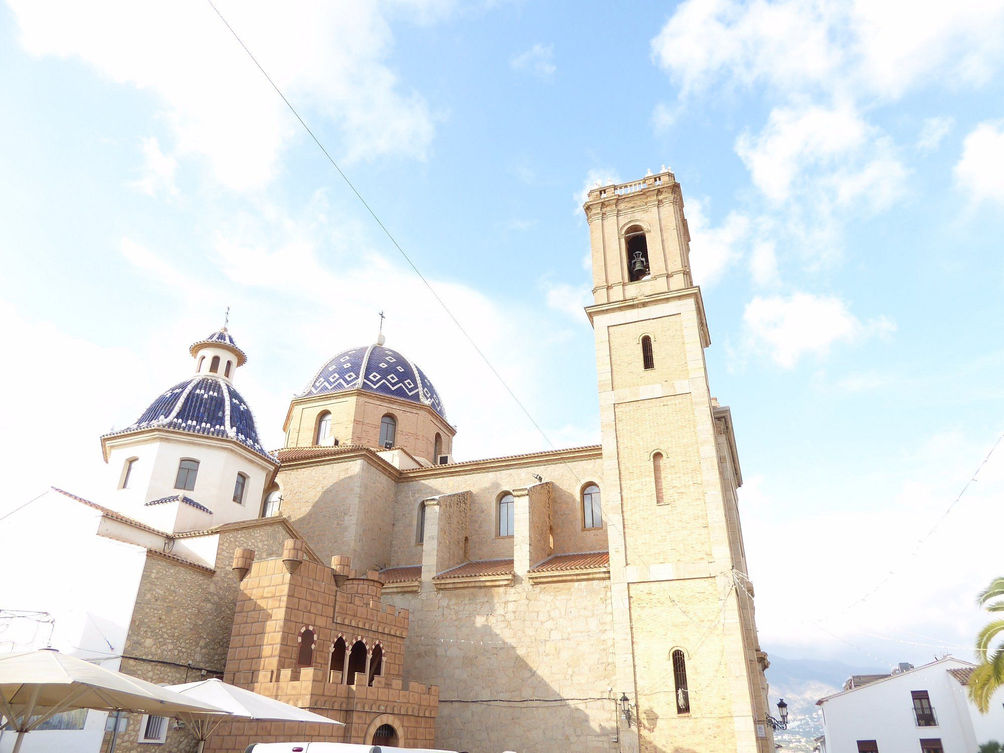 The iconic blue and white tiled domes of the Church of Our Lady of Consolation in Altea's Old Town, Spain.